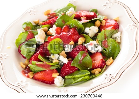Fresh spinach salad with peanuts and blue cheese.