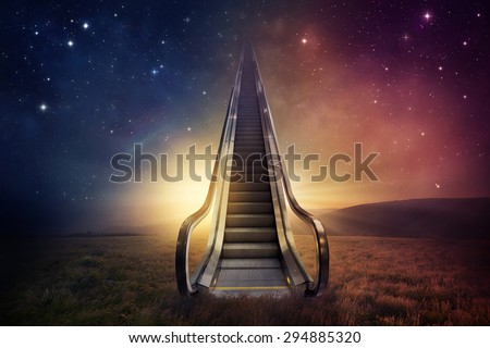 An escalator goes up to the night sky.