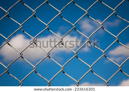 Chain Link Fence With Blue Sky Background