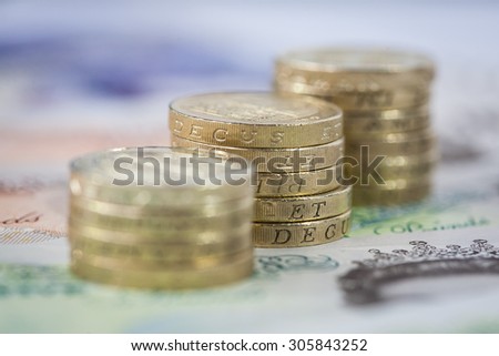 Increasing Graph Style Money Stack of British Pound Coins on Notes