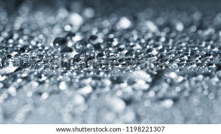 close up dew drop on gray background.crystal bokeh.