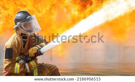 Similar – Image, Stock Photo Serious fireman in protective uniform with radio set