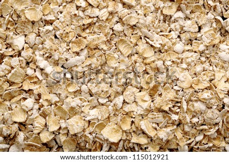 Heart shape oatmeal on wooden background. Good for healthy food concept