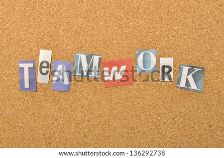 Teamwork word made from newspaper letter shot over pinboard background