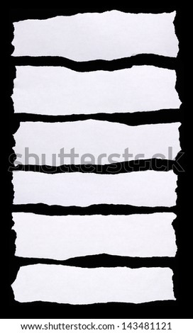 Pieces of torn white paper on black background. You can put your message on the paper