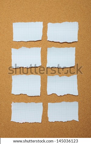 Set of blue torn piece of paper over brown background