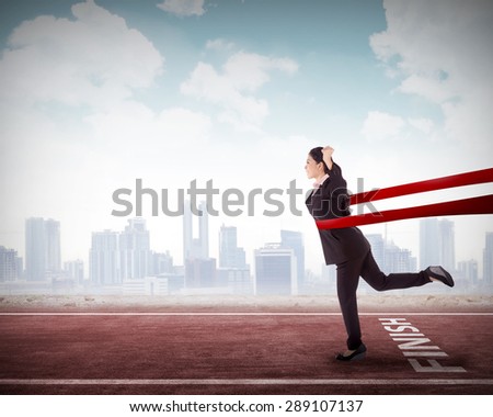 Concept of successful asian business woman in a finishing line