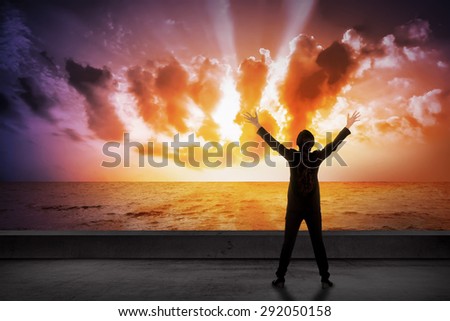 Asian business woman looking the cloud on the sea. Business success concept