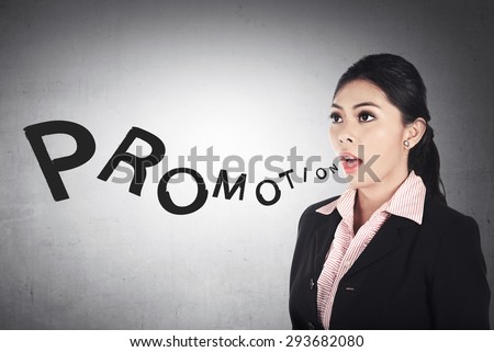 Business woman shout promotion word. Promotion and career concept