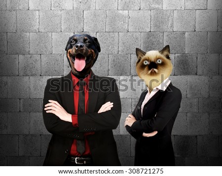 Formal wear business man and woman with dog and cat head