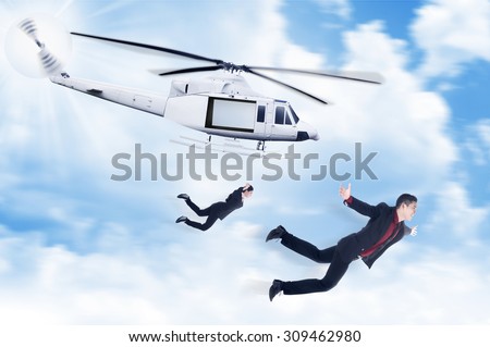 Business man and woman jump from helicopter. Business challenge concept
