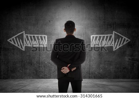 Business man has to choose between two way. Business option conceptual