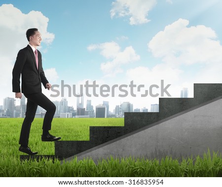 Confident business person walking upstairs. Business career concept