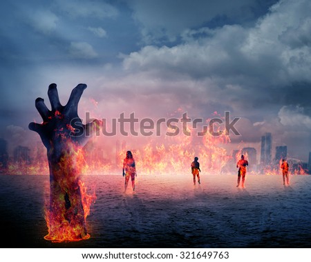 Zombie hand with fire rising from the ground. Halloween concept