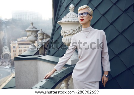 Beautiful sexy young business woman blond hair evening makeup wearing dress suit top  skirt high heels shoes business clothes for meetings walks summer fall collection perfect body shape glasses hotel