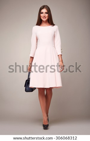 Beautiful sexy young business woman brunette hair evening makeup wearing dress suit top white skirt high heels shoes business clothes for meetings walks summer fall collection perfect body shape