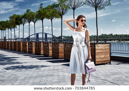 https://image.shutterstock.com/display_pic_with_logo/2391122/703844785/stock-photo-beautiful-woman-walk-on-the-street-square-wear-fashion-style-clothes-white-cotton-dress-accessory-703844785.jpg