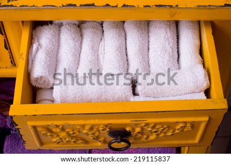 Roll Towels overlap,Soft colorful warm blankets in the seizures products,Towels in open drawer close up