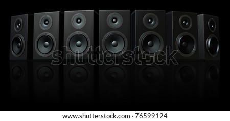 3D Render of loud speakers on a black reflective background