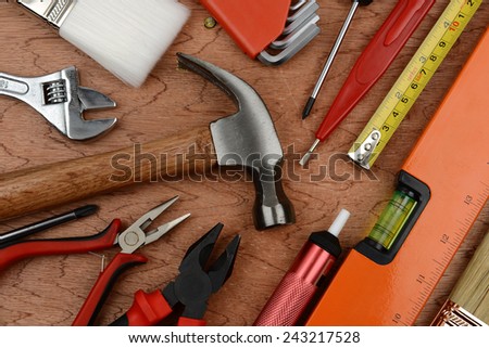 Set of manual tools on a wooden boards background