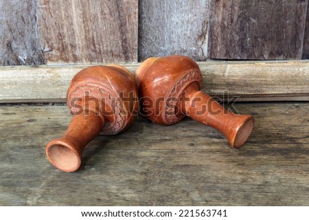 Old clay ceramic vase, Old clay ceramic vase in wooden background.