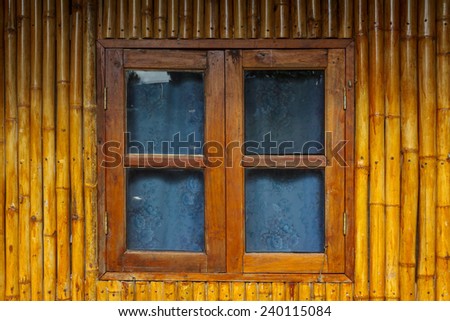 Wooden bamboo window on bamboo background. Wooden Window