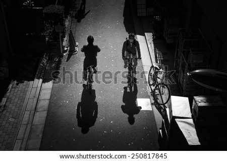 TOKYO, JAPAN - NOVEMBER 22: People ride bicycles on November 22, 2013 in Tokyo, Japan. Cycling is one of most popular transport modes in Japan.