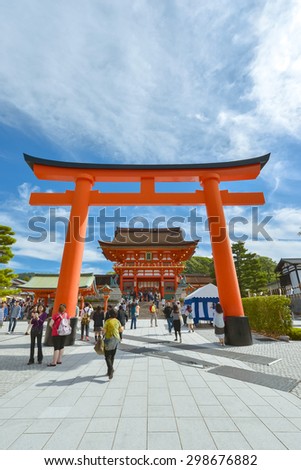 Kyoto, Japan - OCTOBER 10, 2014 : Tourist in Fushimi Inari Taisha Shrine on October 10, 2014. Fushimi Inari Taisha Shrine is one of the most popular tourist place in Kyoto, Japan.