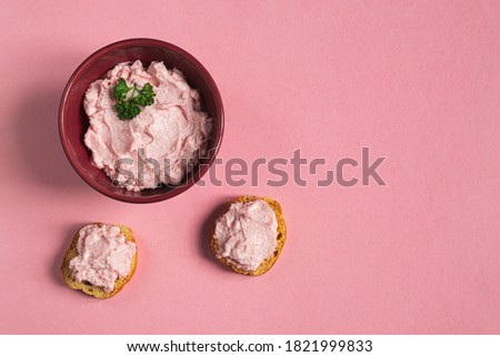 A bowl and crostini with tarama or taramasalata canape isolated on the pink background Stok fotoğraf © 