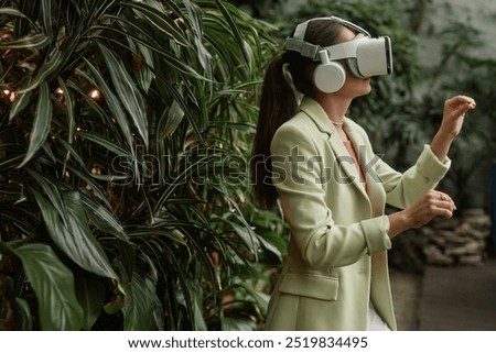 Similar – Image, Stock Photo Unrecognizable woman in VR goggles controlling drone