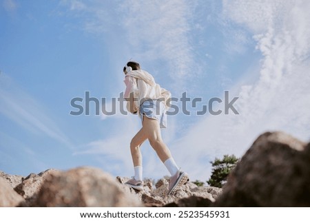 Similar – Image, Stock Photo Unrecognizable fit woman in swimsuit standing on sandy beach