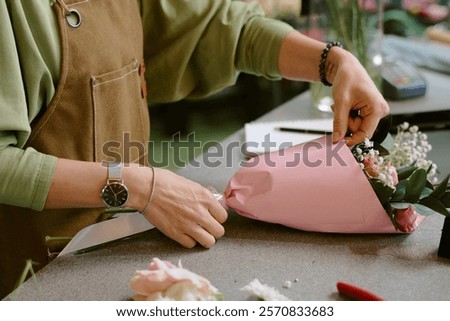 Similar – Image, Stock Photo Unrecognizable female professional florist making bouquets.