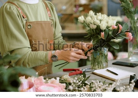 Image, Stock Photo Unrecognizable female professional florist making bouquets.