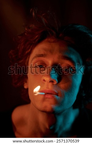 Similar – Image, Stock Photo Adult man smoking while looking at camera during sunset