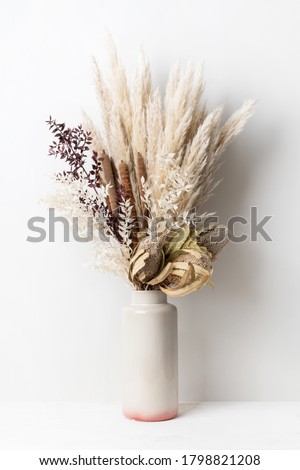 Stylish modern dried flower arrangement in a cream and pink vase. Including Banksia, pampas grass, bulrush and ruscus leaves. Art decoBoho gift for Anniversary, birthday, mothers day.