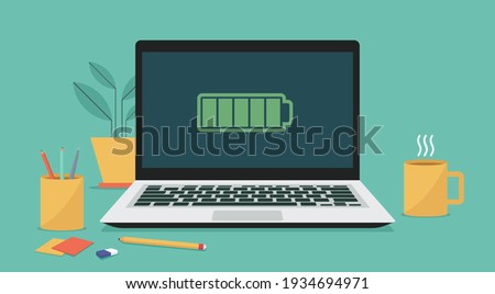 Laptop computer with full battery icon on screen, flat vector illustration