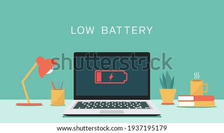 Laptop computer with low battery icon on screen, flat design vector illustration