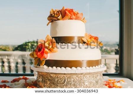 Tropical Orange & Brown Wedding Cake