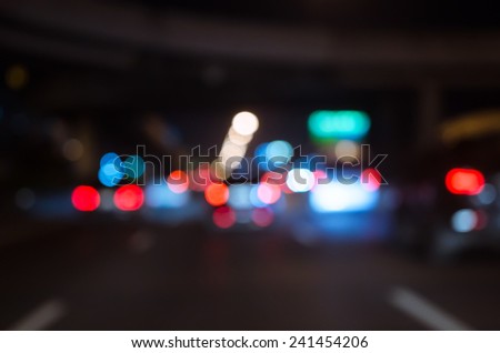 Blurred Defocused Lights of Traffic on a City Road at Night