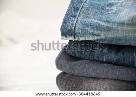 Pile of blue jeans close up,blue jeans texture