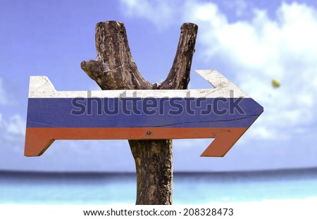 Russia wooden sign with a beach on background
