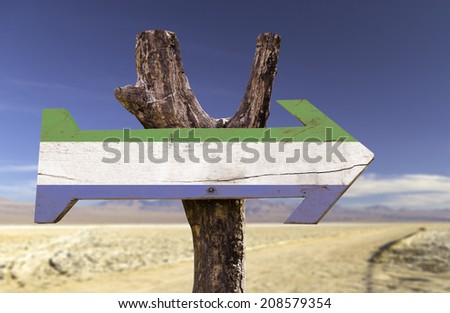 Sierra Leone wooden sign with a desert background