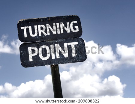 Turning Point sign with clouds and sky background