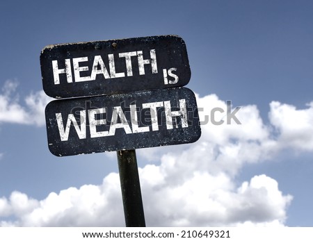 Health is Wealth sign with clouds and sky background