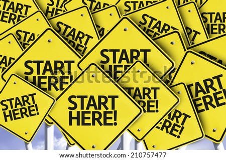 Start Here! written on multiple road sign