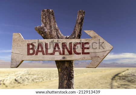 Balance wooden sign with a desert background