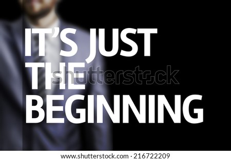 It\'s Just the Beginning written on a board with a business man on background