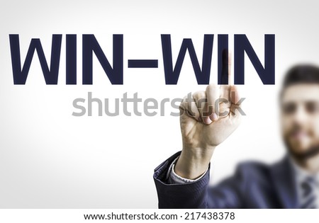 Business man pointing to transparent board with text: Win-Win