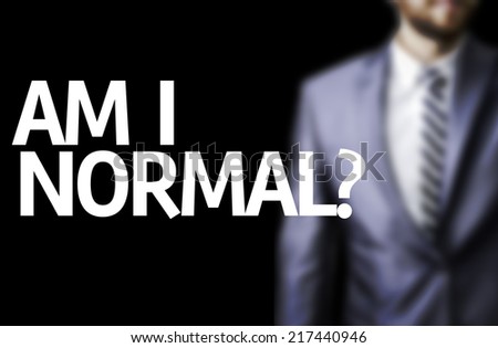 Am I Normal? written on a board with a business man on background