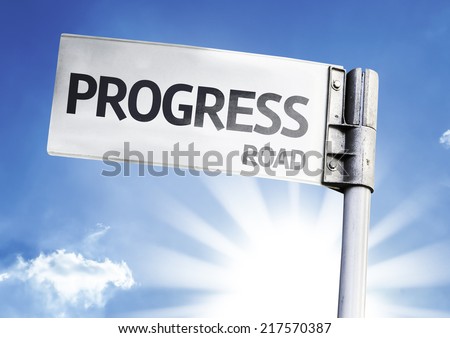 Progress written on the road sign